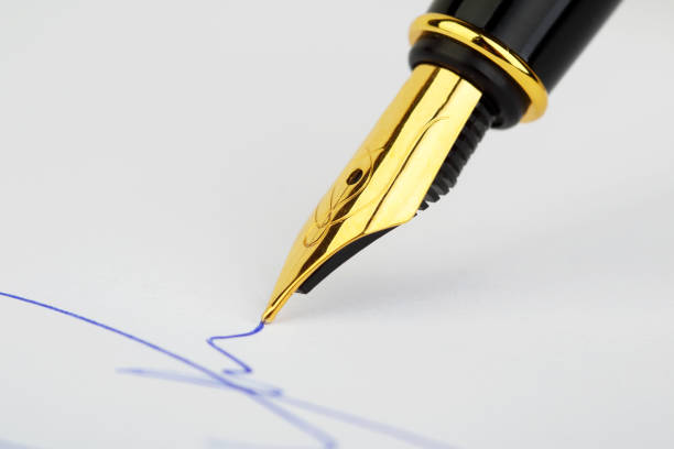 close up of fountain pen and signature. - contract signing document legal system imagens e fotografias de stock