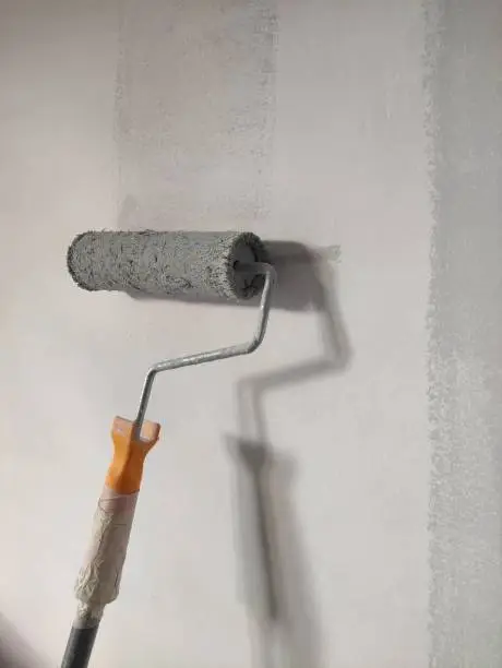The wall is painted by paint roller