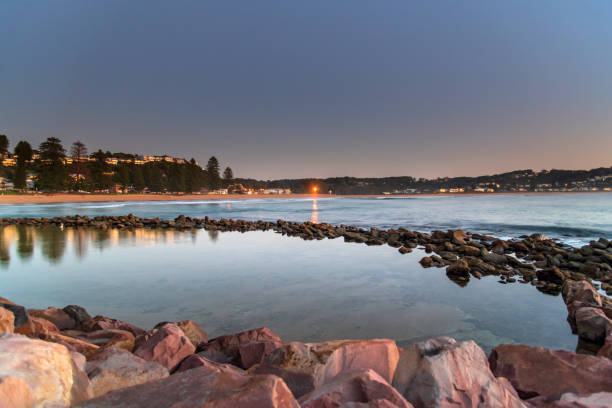 Early mornings at the seaside Sunrise seascape and rock pool at Avoca Beach on the Central Coast, NSW, Australia. avoca beach photos stock pictures, royalty-free photos & images