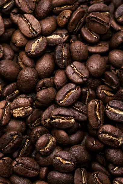 Brown roasted coffee beans. Closeup shot of coffee beans