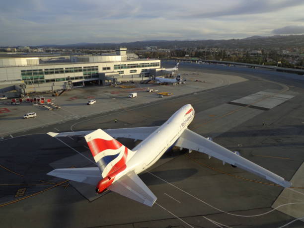 Aerial View of Boeing 747-400 at SFO A British Airways Boeing 747-400 pushes back from the International Terminal at San Francisco International Airport (SFO) on November 19, 2015 british airways stock pictures, royalty-free photos & images