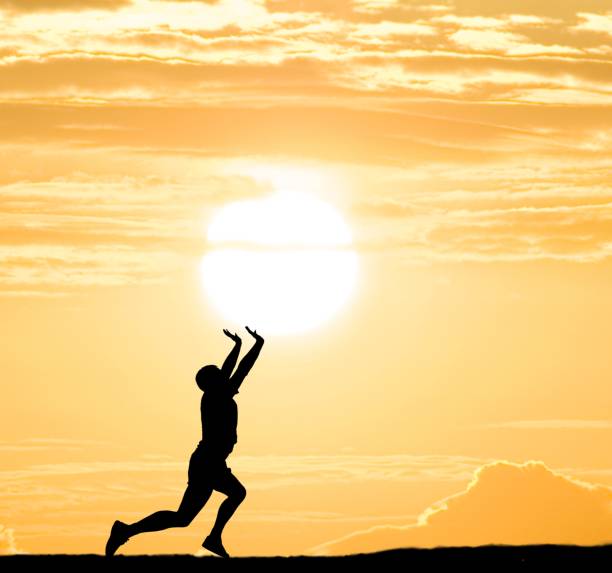 istock man silhouette pushing the sun 1319737894