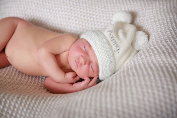 istock The baby boy is sleeping on a soft blanket. 1319739686