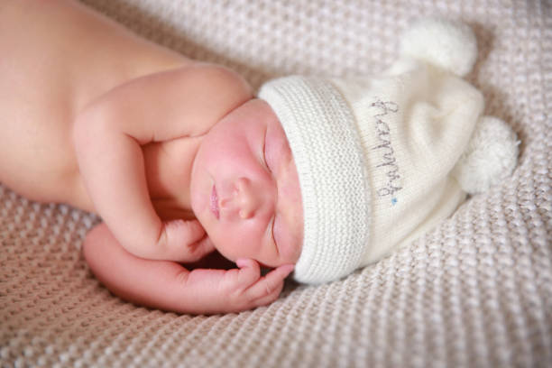 istock The baby boy is sleeping on a soft blanket. 1319739701