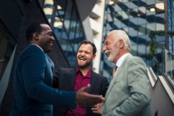 istock Three business men talking. Focus is on senior man. 1319741030