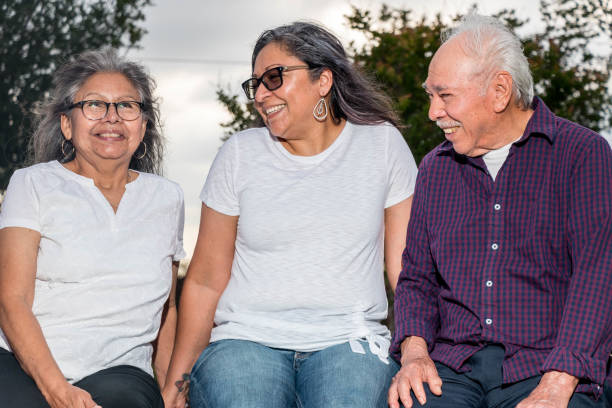 istock Family Laughing On A Bench 2 1319741872