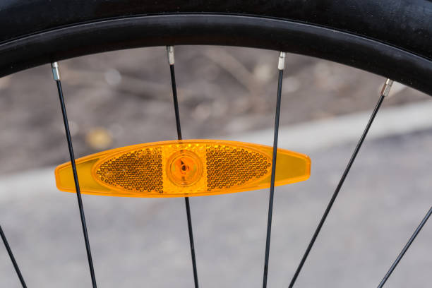 istock Fragment of bicycle wheel with plastic reflector between the spokes 1319742002