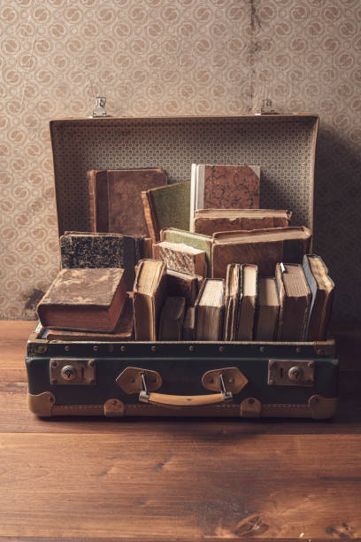 istock Old suitcase full of vintage books 1319742052