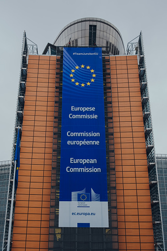 Brussels, Belgium - August 17, 2019: Facade and European Commission sign on The Berlaymont, an office building in Brussels, Belgium, which houses the headquarters of the European Commission