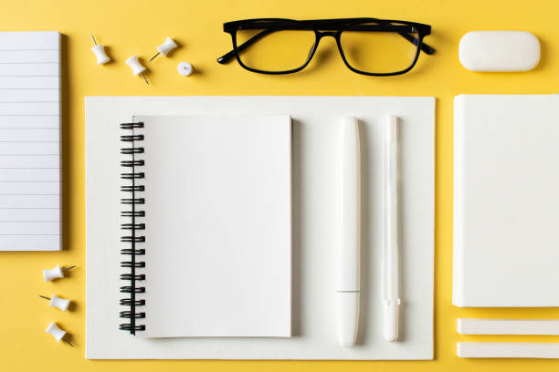 istock Back to school theme with papernote and white schools tools on yellow background 1319744632