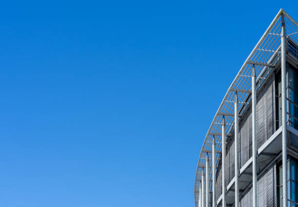 istock Low Angle View Of Modern Building Against Clear Blue Sky 1319746332