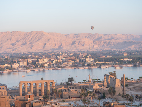 High angle view of the city of Luxor , the Nile river and the Valley of the Kings. POV from balloon
