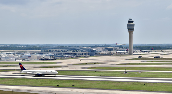 Atlanta, Georgia, USA - June 22, 2016: A Delta Air Lines Boeing 767 speeds down the runway during takeoff at Hartsfield-Jackson Atlanta International Airport.