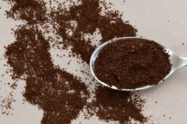 istock Milled fresh coffee powder in a spoon. 1319754470