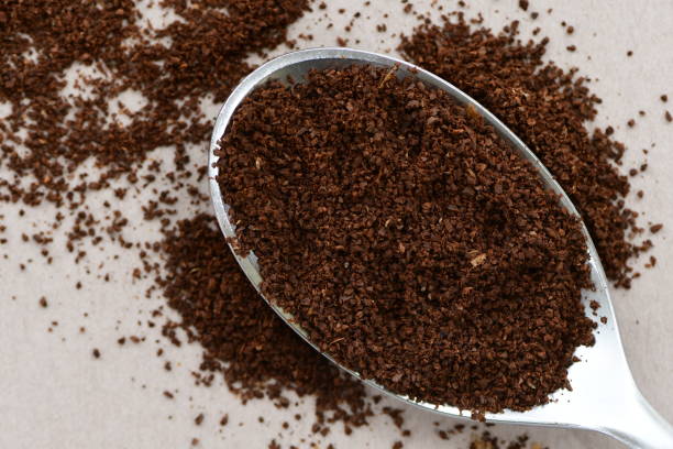 istock Milled fresh coffee powder in a spoon. 1319754485