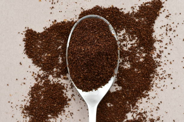 istock Milled fresh coffee powder in a spoon. 1319754526