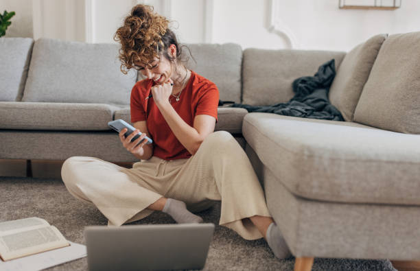 istock Young woman studying on the floor 1319759696