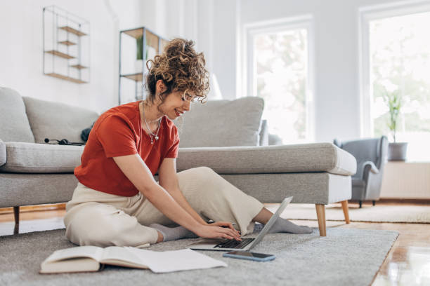 istock Young woman studying on the floor 1319759777