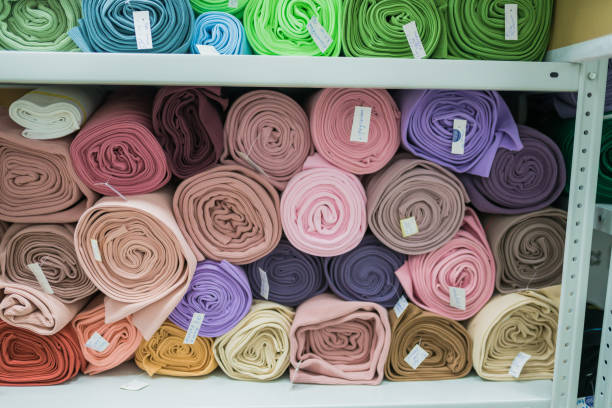 istock Drapery shop. Fabric rolls in textile store. 1319762055