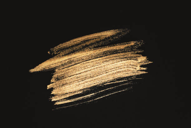 istock Abstract golden watercolor stain on black background 1319762281