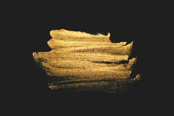 istock Abstract golden watercolor stain on black background 1319762380