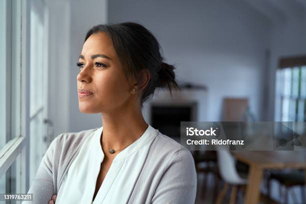 Thoughtful Black Woman Looking Outside Window Stock Photo - Download Image Now - Contemplation, Women, One Woman Only