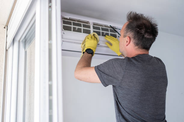 istock Technician cleaning air conditioner indoors 1319763402