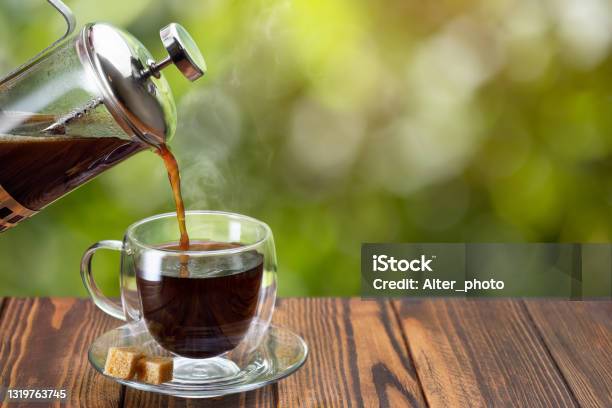 Coffee From French Press Pouring Into Cup Stock Photo - Download Image Now - French Press, Coffee - Drink, Pouring