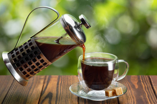 istock coffee from french press pouring into cup 1319763757