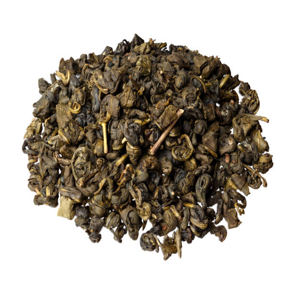 istock Large leaf milk oolong Chinese green tea close-up, isolated on white. 1319763837