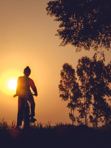 istock Cyclist against sunrise 1319765062