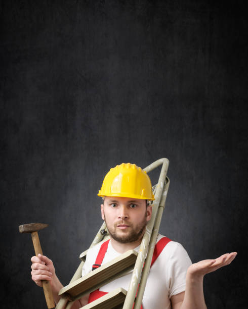 istock Portrait of a clumsy worker with tools 1319765904