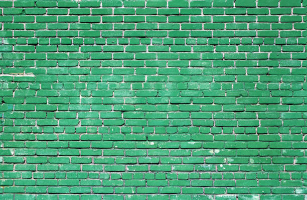 istock Colorful green brick wall texture background. Green brick wall texture architecture pattern. 1319767982