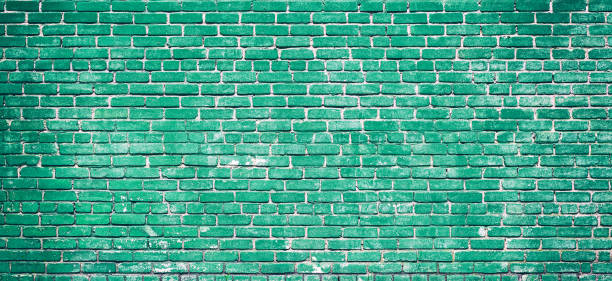 istock Colorful green brick wall texture background. Green brick wall texture architecture pattern. 1319767986