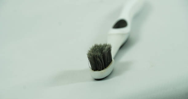 istock toothbrush closeup selective focus background in white background image 1319769364
