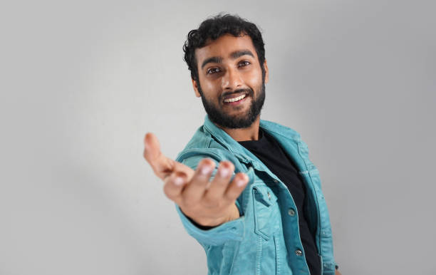 istock a man giving hand for help in white background 1319769522