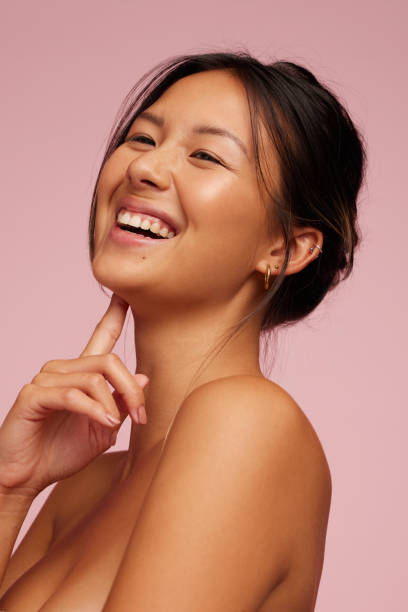 istock Smiling woman with glowing skin 1319772690