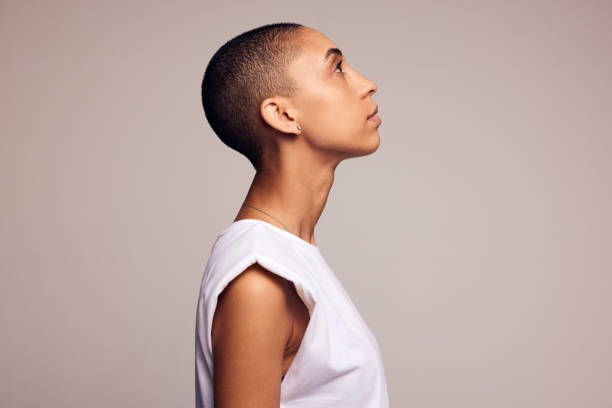istock Androgynous woman with shaved head 1319773070