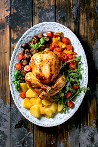 istock Grilled cooked whole chicken with grilled bell pepper and potatoes 1319775855