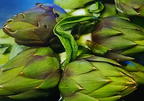 Organic Artichokes and vegetables in a market shelf