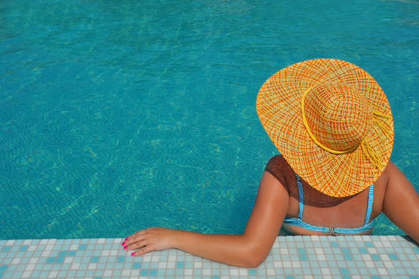 istock Real female beauty relaxing in swimming pool 1319781583