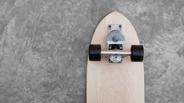 istock Surf skate on floor concrete top view background activity extreme sport 1319782165