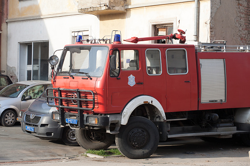 Picture of a fire truck from the serbian fire brigade services of the Serbian healthcare system, vatrogasci, parked waiting for intervention in Mladenovac, serbia.