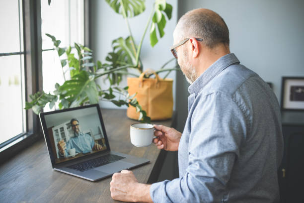 istock mature adult man working from home office ( with laptop,Video Conference) 1319786144