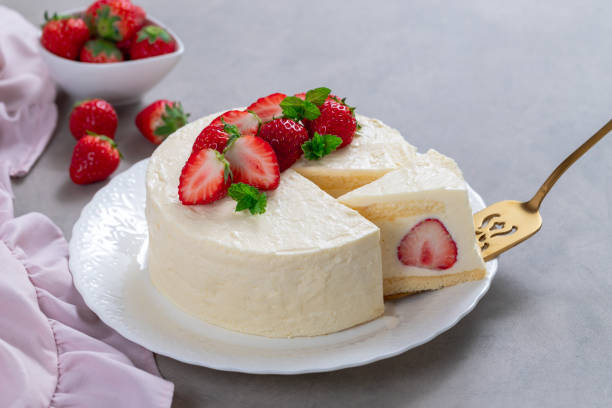 istock Delicious cheesecake with fresh strawberries without baking on a gray background 1319788467