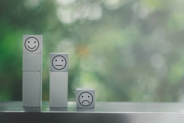 istock Wooden blocks with the face face symbol, evaluation, Increase rating, Customer experience, satisfaction and best excellent services rating concept with copy space 1319788605