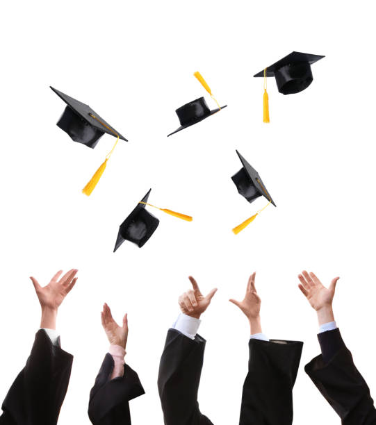 istock Group of graduates throwing hats against white background, closeup 1319788721