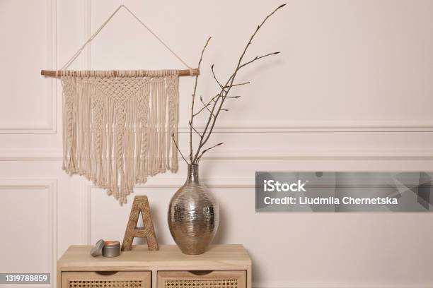 Tree Twigs In Metal Vase And Decor On Wooden Table Near White Wall Space For Text Stock Photo - Download Image Now