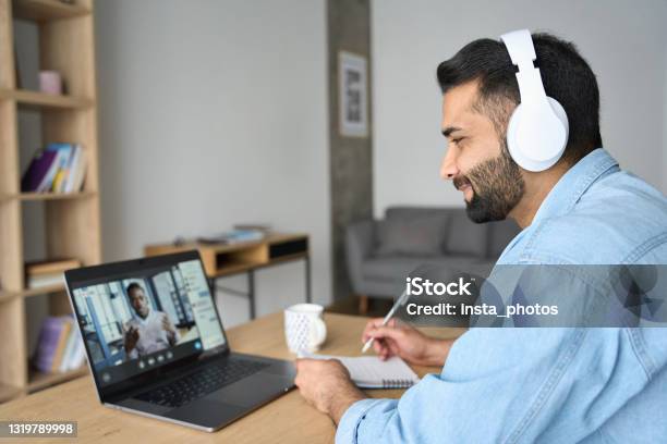 Indian Latin Male Student Having Video Call With Male Teacher On Laptop Stock Photo - Download Image Now