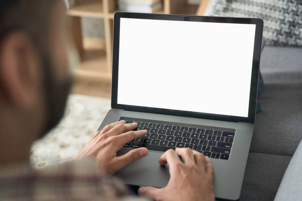 istock Indian businessman typing working using laptop at home office. 1319790060